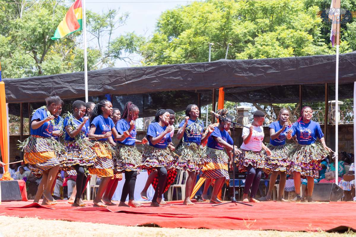 The college cultural dance team performing in traditional dress