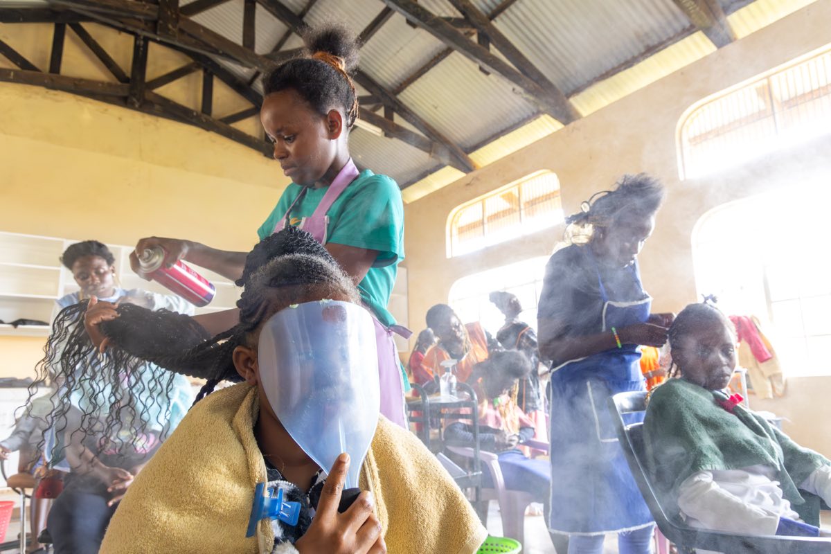 Hairdressing trainees at work in the training salon